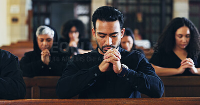 Buy stock photo Religion, prayer and man in church with congregation for memorial, burial or funeral service. Worship, spiritual guidance and male person with praying for hope, faith or respect with gospel in chapel
