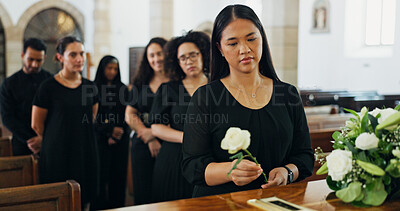 Buy stock photo Sad, woman and rose at funeral for farewell service, mourning death and goodbye at burial ceremony. Person, flower and respect with rip, memorial comfort and emotional gathering at community church