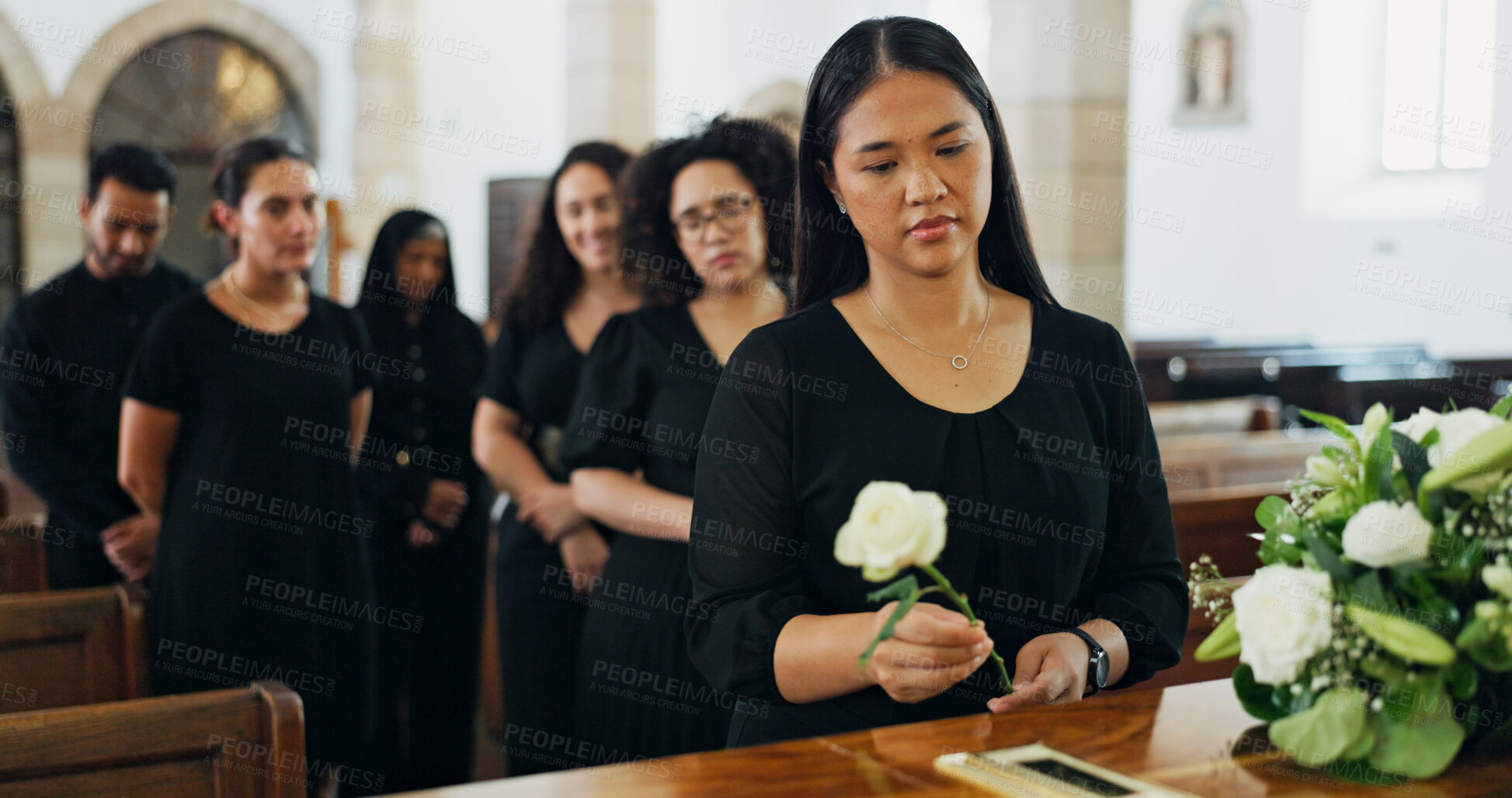 Buy stock photo Sad, woman and rose at funeral for farewell service, mourning death and goodbye at burial ceremony. Person, flower and respect with rip, memorial comfort and emotional gathering at community church