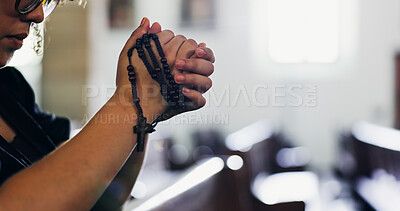 Buy stock photo Hands, praying and woman with rosary in church for spiritual service with gratitude. Worship, religion and female person with crucifix for prayer for hope, faith or respect with gospel in chapel.