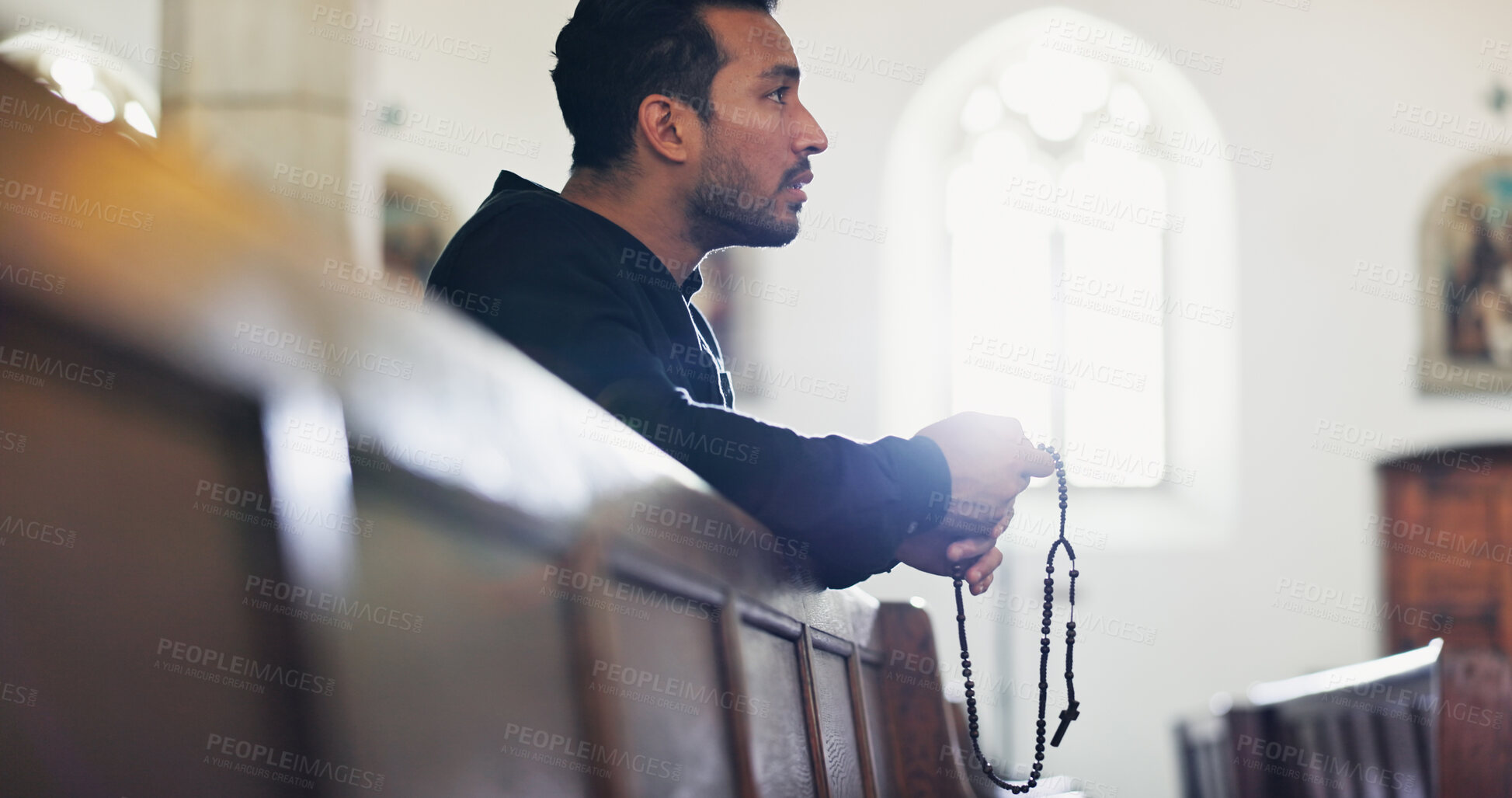 Buy stock photo Praying, faith and man with beads, church and Christian with respect for God, belief and holy spirit. Worship, gospel and person with rosary for confession, mercy and asking for advice with necklace