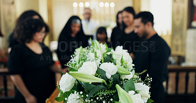 Buy stock photo Funeral, respect or family with flowers in church for farewell service, mourning death or grief. Bouquet, dead or people with casket or coffin in Christian cathedral for burial, support or memorial