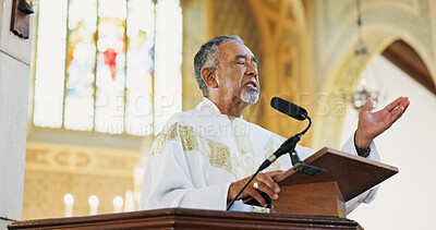 Buy stock photo Christianity, pastor and praying in church, belief and preaching with microphone for faith or gospel. Podium, preacher and mature man with speech for religion, Easter service or sermon to worship God