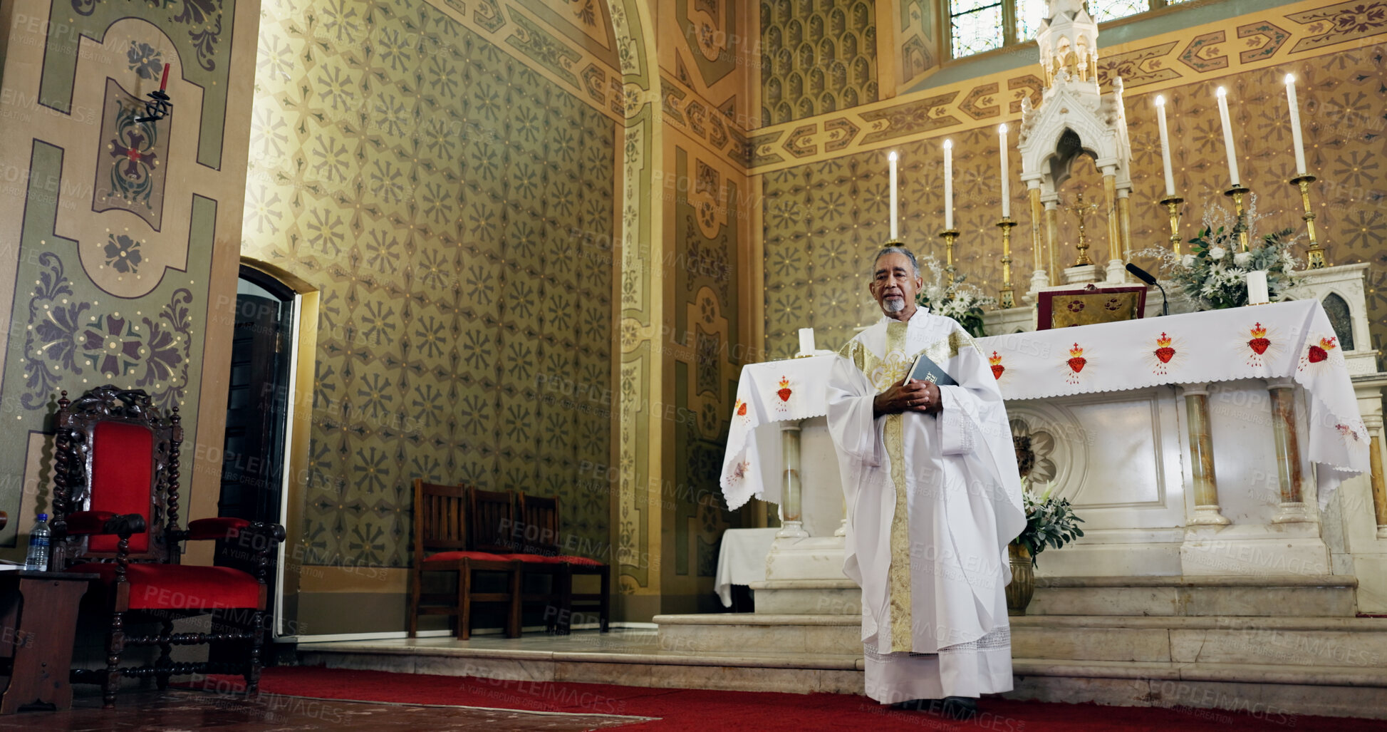 Buy stock photo Church, priest and man with bible, holy and preacher with book for sermon, Christianity or spiritual. Worship, God and mature person with faith for ceremony, catholic and prayer with gospel or belief