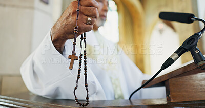 Buy stock photo Rosary, hand and preacher praying in church as Christian for salvation, service and worship with faith. Religion, bishop and respect with man or praise for guidance, speech and spiritual ceremony