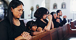 Religion, praying and family in church for memorial, burial or funeral service with congregation. Worship, spiritual guidance and people with prayer for hope, faith or respect with gospel in chapel.