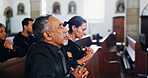 Religion, praying and man in church with family for memorial, burial or funeral service. Worship, spiritual guidance and senior person with prayer for hope, faith or respect with gospel in chapel.
