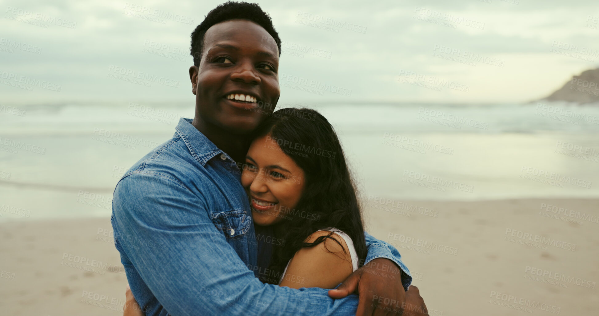 Buy stock photo Hug, smile and date with interracial couple at beach for romantic vacation, travel adventure and bonding. Happiness, holiday and partner with man and woman embrace for honeymoon, trust and love