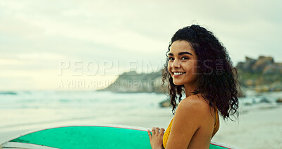 Buy stock photo Girl, surfboard and happy in portrait at beach for water sports, hobby and outdoor on holiday. Woman, surfer and smile with space for workout, fitness and ready for waves by ocean in Costa Rica