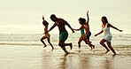 Happy, running and friends on beach with freedom, travel or excited on summer vacation. People, energy and playing at ocean space for holiday, water adventure or bonding at reunion at tropical island