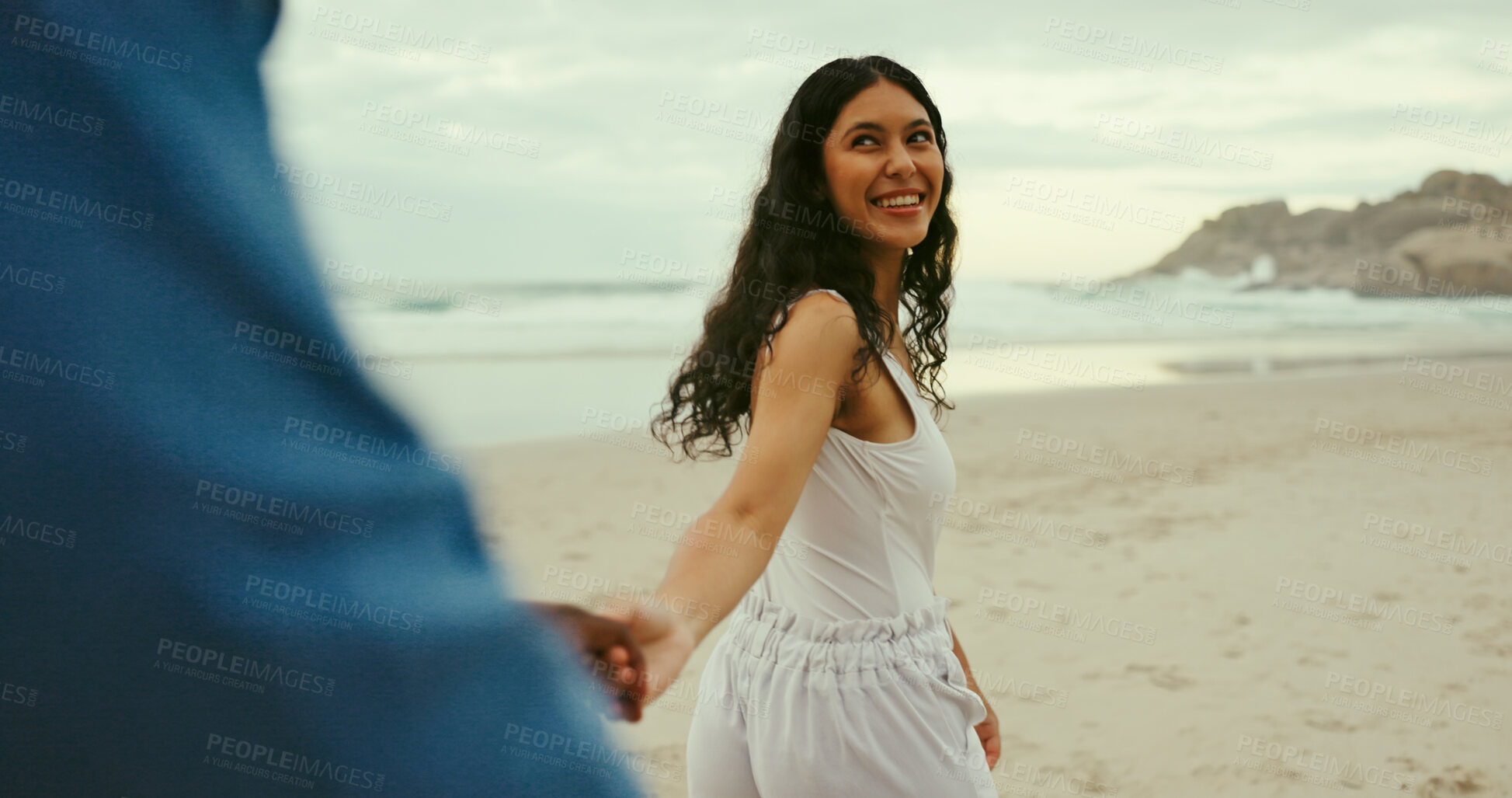 Buy stock photo Holding hands, smile and love with couple at beach for romantic vacation, travel adventure and bonding. Happiness, holiday and partner with man and woman outdoors for honeymoon, relax and date