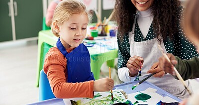 Buy stock photo Education, girl and teacher with painting for kindergarten, creativity or skills development. Classroom, drawing or child as student for artwork project, learning or motor growth with brush in school