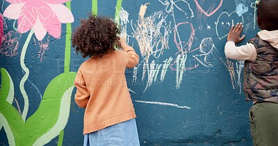 Buy stock photo Wall, kids and creative with chalk for drawing, cognitive development and education in school. Back, students and children with learning for writing mural, inspiration and outdoor in kindergarten
