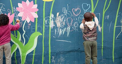 Buy stock photo Wall, children and drawing with chalk for education, cognitive development and creativity in school. Back, students and kids with learning for writing mural, inspiration and outdoor in kindergarten