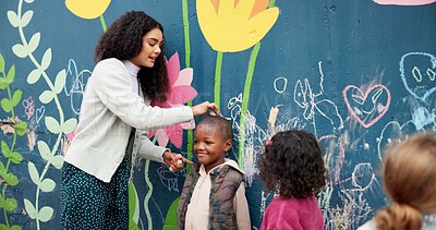 Buy stock photo Teacher, children or height drawing with chalk on wall for fun outdoor activity at kindergarten. Educator, kids or creative youth with marking for size, mural or childhood growth at elementary school