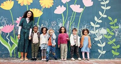 Buy stock photo Teacher, children and mural on school wall for creative education, chalk drawing or sustainable awareness. Portrait, people and kid students by floral painting for earth day art lesson or development