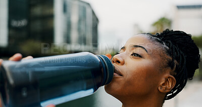Buy stock photo Black woman, drinking water and hydration outdoor for health, wellness and electrolyte liquid with fitness. Bottle, aqua or mineral beverage for exercise, nutrition and healthy with thirst in city
