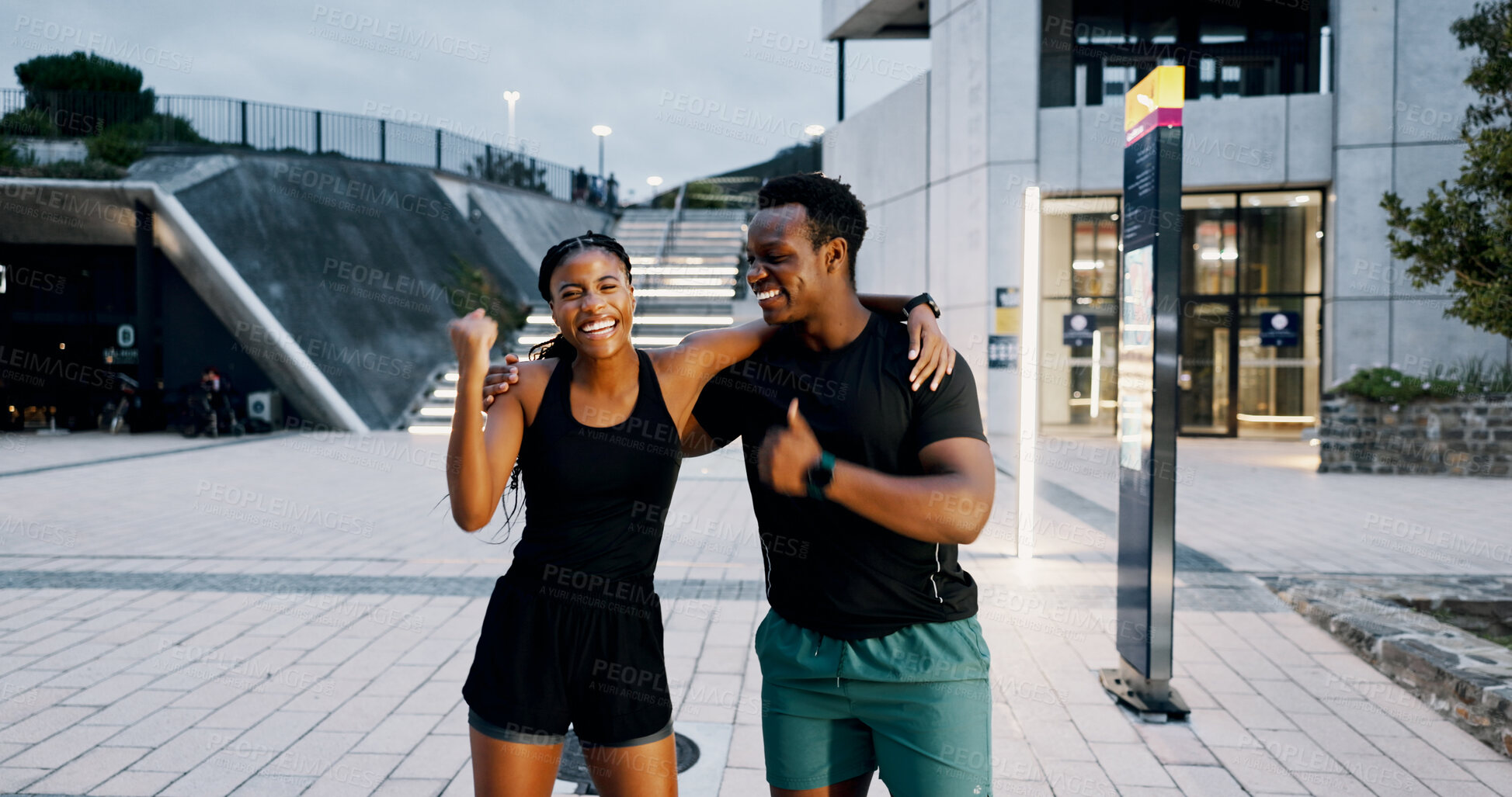 Buy stock photo Runner, hug and smile with black people in city for personal trainer, workout goals and fist bump. Coaching success, night and teamwork with man and woman outdoors for exercise, wellness or celebrate