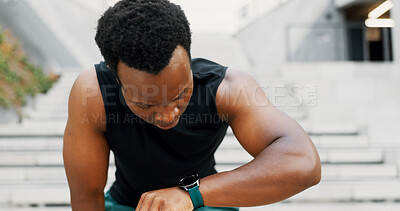 Buy stock photo Runner, tired and smart watch with black man in city for fitness app, tracking progress and heart rate. Wellness, training and speed challenge with person and time for exercise, sports and cardio