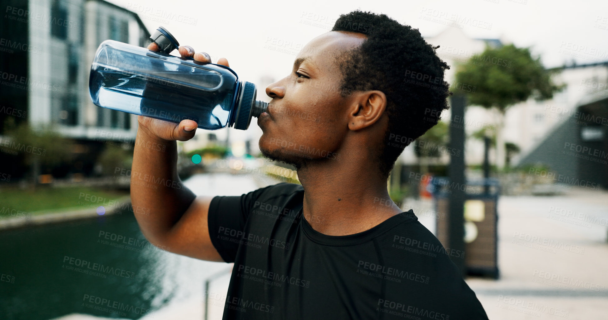 Buy stock photo Black man, drinking water and hydration outdoor for health, wellness and electrolyte liquid with fitness. Bottle, aqua or mineral beverage for exercise, nutrition and healthy with thirst in city