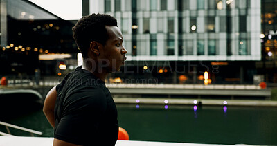 Buy stock photo Running, speed and health with black man in city for training, marathon and challenge. Cardio performance, workout and wellness with male person at night for sports athlete, fitness and exercise