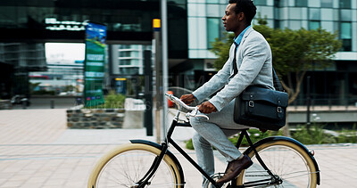 Buy stock photo Cycling, commute and business with black man in city for carbon footprint, travel and professional. Sustainability, bicycle and journey with person downtown for eco friendly transport and wellness