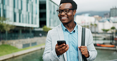 Buy stock photo Happy, phone and business black man in city online for morning commute, travel and journey to office. Nigeria, corporate and person on smartphone for networking, connection and internet in town