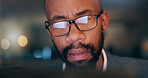 African man, computer and closeup at office, night and reading proposal with overtime at media company. Person, editor or writer by pc with glasses for deadline, project or time management at agency