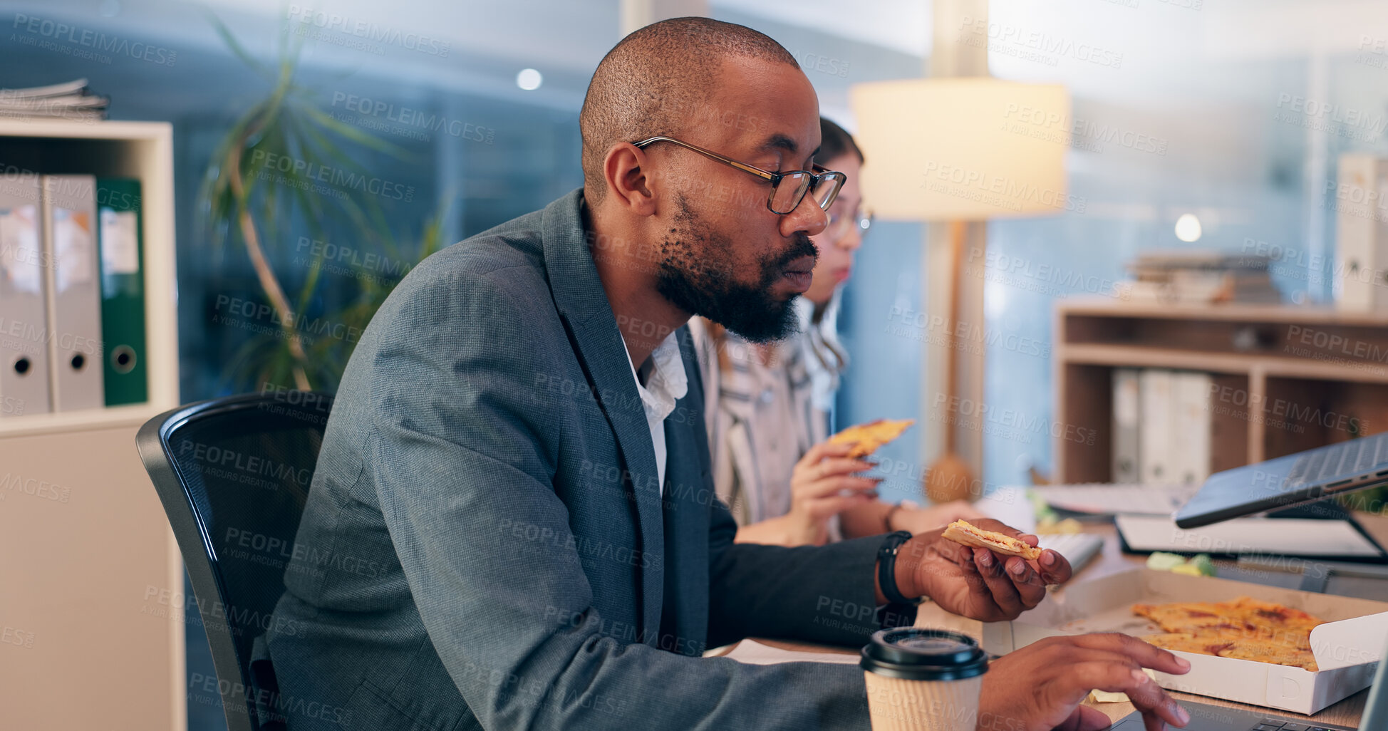 Buy stock photo Businessman, laptop and pizza at night, office and overtime with review, scroll or reading proposal at media startup. Person, writer and pc with fast food for project management at creative agency