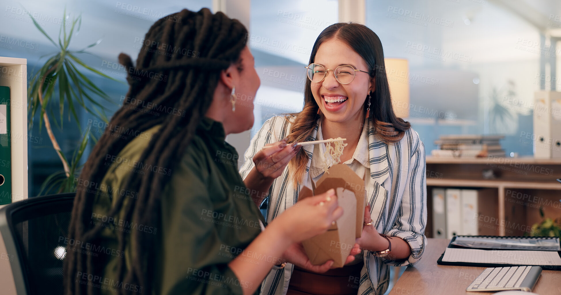 Buy stock photo Women, together and happy with food in office, lunch and talking with funny joke on break at company. People, partner and box for takeaway, smile and listen to comic conversation at creative agency