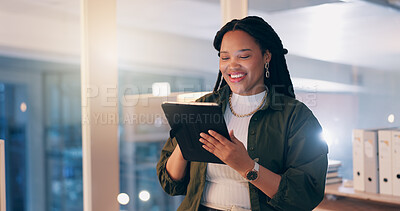 Buy stock photo Black woman, tablet and happy at office, night and reading notification with overtime at media company. Person, journalist or writer on digital touchscreen, app and smile for editing story at agency