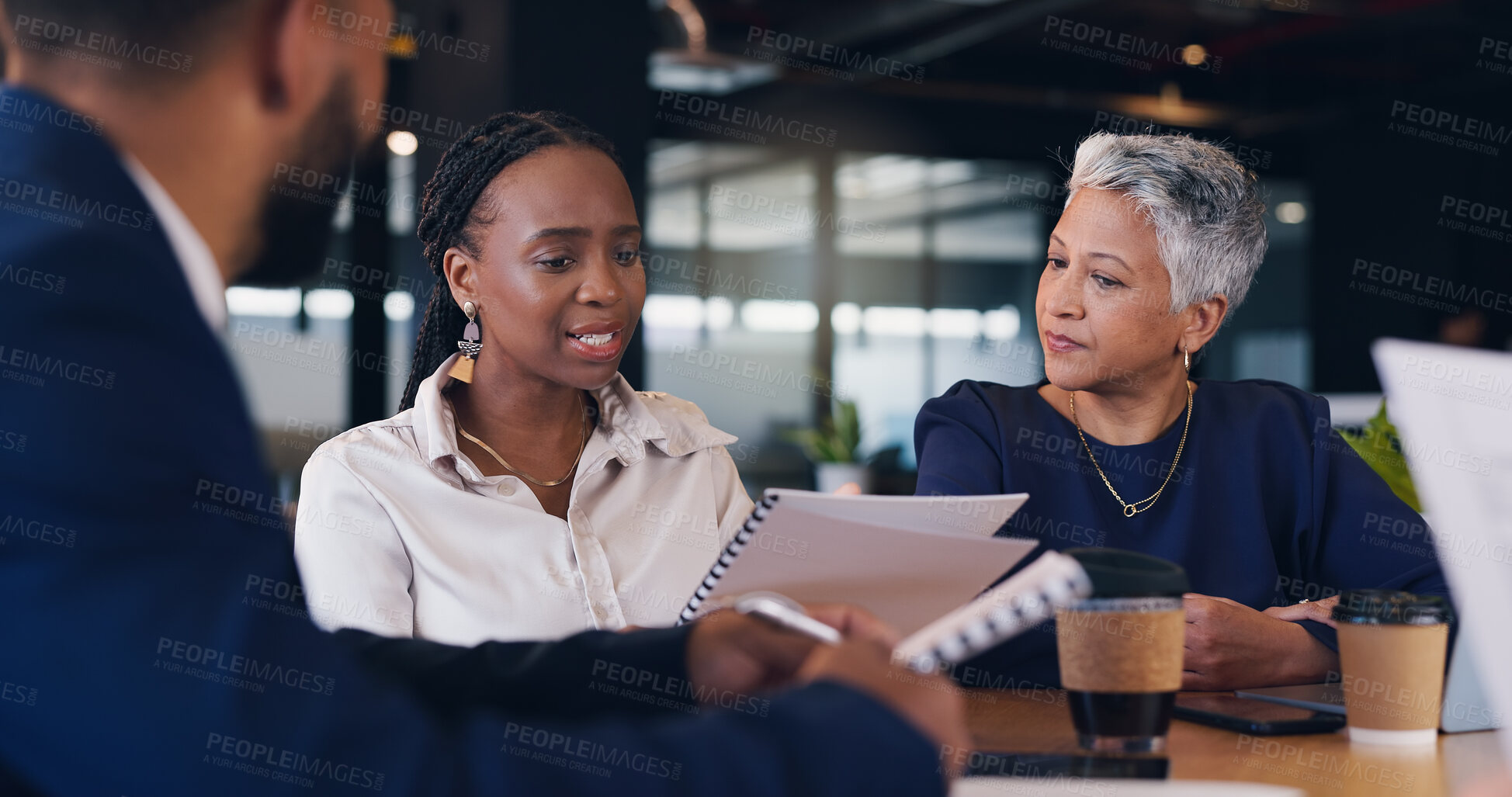 Buy stock photo Group, business people and discussion with paperwork in cafe for brainstorming or problem solving. Meeting, team and planning with project manager for strategy, progress report or explain budget cost
