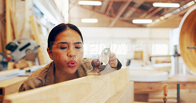 Buy stock photo Carpentry, industry and plane with woman in workshop for manufacturing or production process. Blowing, creative and design with carpenter in woodworking studio for craftsmanship or manual labor