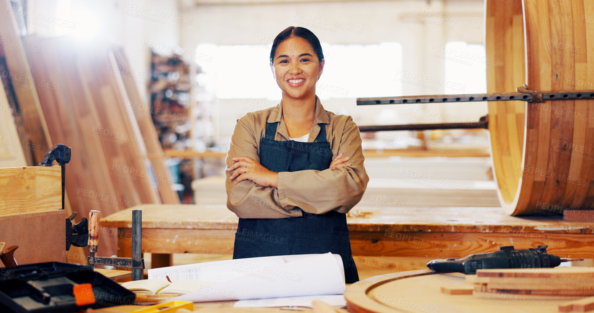 Buy stock photo Arms crossed, carpentry and portrait with woman in workshop for manufacturing or production process. Design, industry and plans with carpenter in woodworking studio for craftsmanship or manual labor