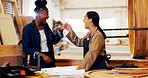 Fist bump, women and carpenter with customer in workshop for furniture, process or manufacturing. Happy, partnership and female woodworker with client in warehouse for timber material production.