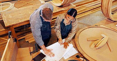 Buy stock photo Man, woman and blueprint with wood at factory, above or review with mentor, training and construction material. People, floor plan and coach with timber, feedback or equipment at industrial warehouse