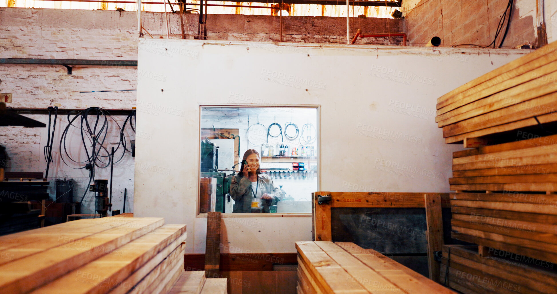 Buy stock photo Woman, phone call and smile at factory with wood, order or stock for construction material at plant. Person, smartphone and inventory with timber for manufacturing, storage or lumber at warehouse