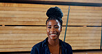 Black woman, portrait and smile with wood at warehouse, pride and ready for career at lumber plant. Person, happy and job with timber production, manufacturing and industry at factory in Nigeria