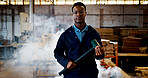 Demolition, hammer and portrait of black man in construction industry for building remodel. Contractor, renovation and tool with serious person in factory, plant or warehouse for lumber occupation