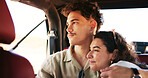 Couple, relax and hug in car for road trip for travel, partner affection and vacation journey. People, embrace and sightseeing for summer holiday, getaway adventure and bonding together for romance
