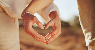 Buy stock photo Couple, shape and love with heart hands or sunshine in nature for romance, outdoor date or valentines day. Closeup, people or icon with symbol for romantic gesture, kindness or thank you together