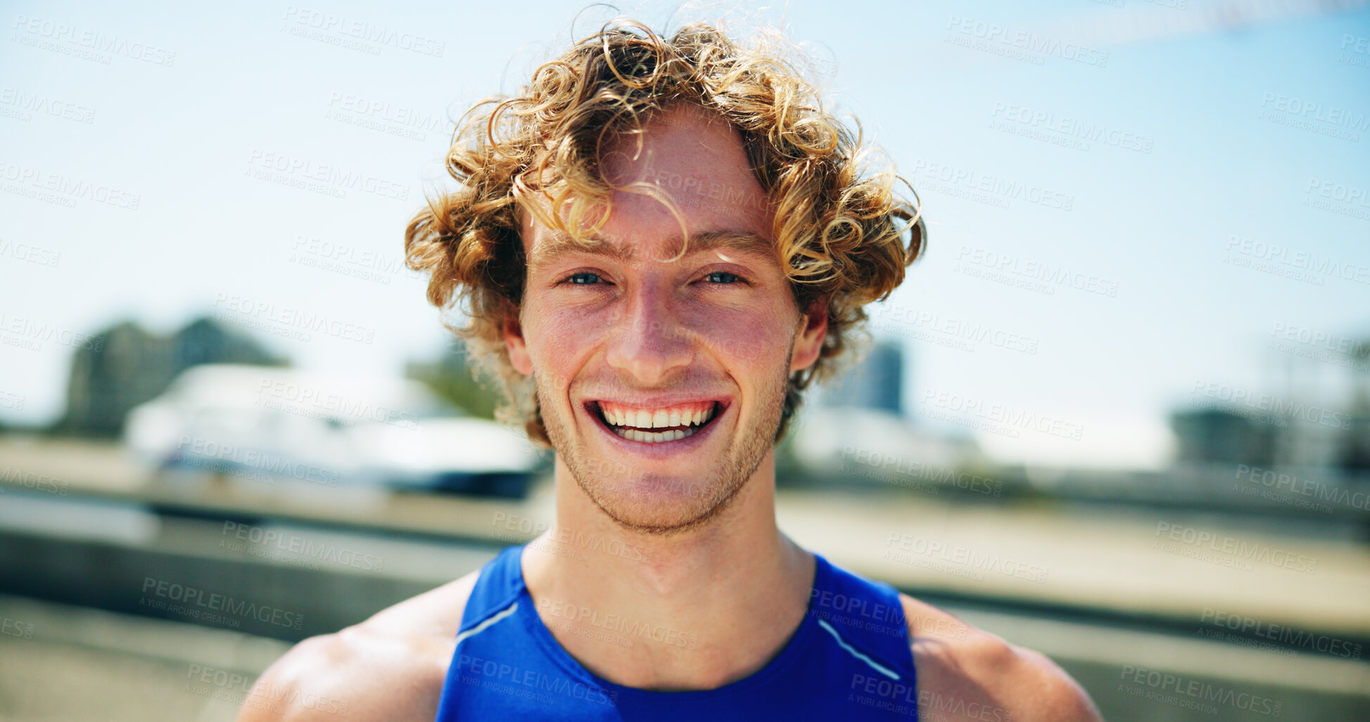 Buy stock photo Man, runner and happy in portrait in city, bridge and outdoor for fitness, training and ready for challenge. Person, smile and pride for workout, exercise and start routine on urban street in Spain