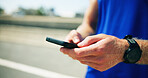 Runner, road or phone in hands with fitness for checking workout progress, tracking exercise or wellness. Person, closeup or athlete on mobile app in city for online running route, map and navigation