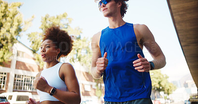 Buy stock photo Couple, fitness and running for workout in city, cardio together with exercise and wellness. Interracial people, marathon training or sports challenge with team, urban and athlete partners outdoor