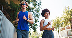 Couple, exercise and running for workout in city, cardio together with fitness and wellness. Below interracial people,  training or sports challenge with team, urban and athlete partners outdoor
