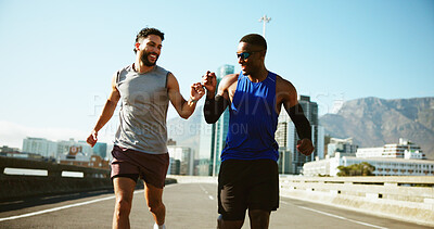 Buy stock photo Happy men, running and city with fist bump for workout, exercise or cardio training on road. Active, male people or runners with success for sport marathon, teamwork or fitness together in urban town