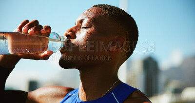 Buy stock photo Fitness, black man and drinking water in city with fatigue, break and relax for exercise recovery. Workout, hydration bottle and thirsty athlete outdoor for wellness, body health or electrolytes
