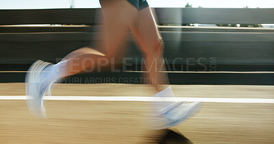 Buy stock photo Motion blur, fitness and legs of person running on bridge in city for race, marathon or training. Sports, fast and feet of athlete on highway with cardio workout, challenge or exercise in town.