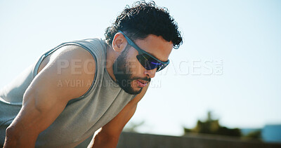 Buy stock photo Fitness, fatigue and man on break in city, exhausted and relax for exercise recovery. Workout, tired and athlete resting outdoor for wellness, body health or think of training challenge for sports