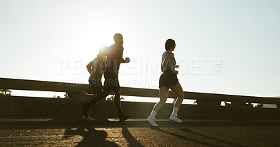 Buy stock photo People, back and running with sunshine in city for workout, exercise or training on road. Active group, friends or runners with bridge for sport, marathon or outdoor sprint together in an urban town